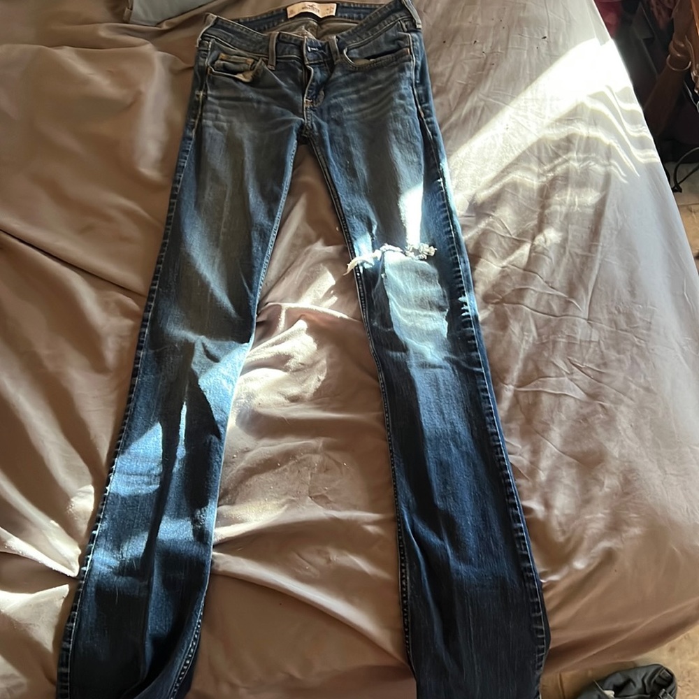 medium wash, hole in knee, boot cut skinny, in decent condition